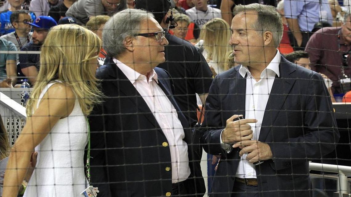 Miami Marlins owner Jeffrey Loria, center, and his wife July chat with Cuban-American billionaire Jorge Mas, one of the bidders to buy the Miami Marlins during the MLB baseball All-Star game on Tuesday, July 11, 2017, at Marlins Park in Miami.