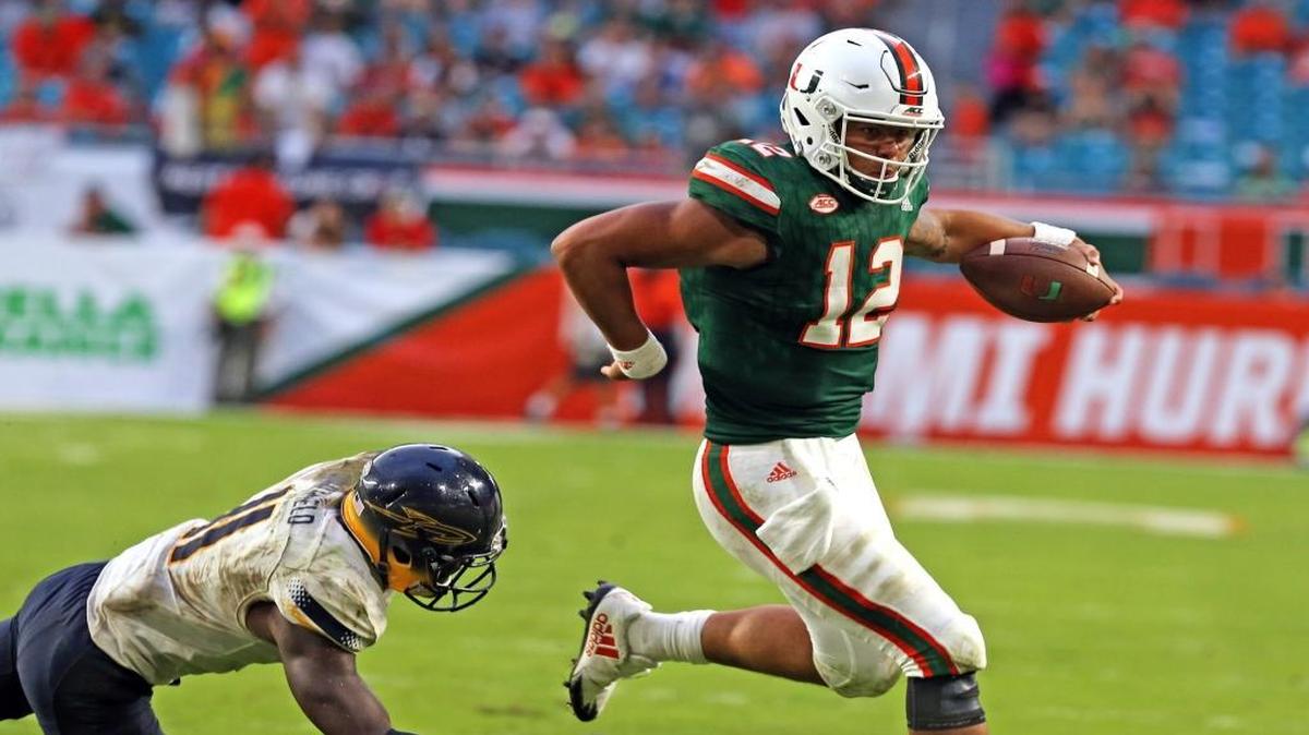Miami Hurricanes quarterback Malik Rosier (12) runs for a fourth quarter touchdown as they play the Toledo Rockets Saturday, Sept. 23, 2017, at Hard Rock Stadium in Miami Gardens, Fla.