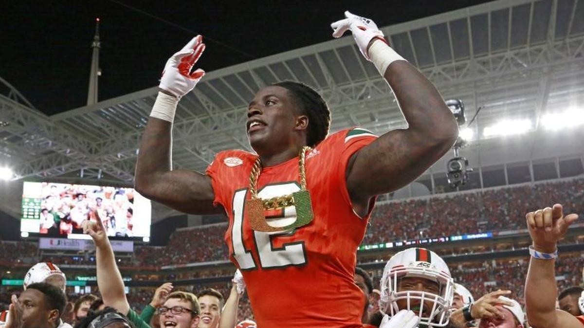 Miami Hurricanes defensive back Malek Young (12) wears the turnover chain after intercepting in the second quarter as the University of Miami Hurricanes host Notre Dame Fighting Irish at Hard Rock Stadium on Sat., Nov. 11, 2017.