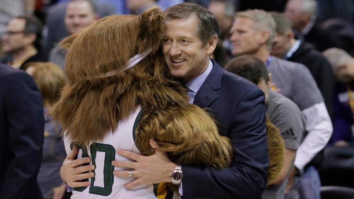 The Utah Jazz Bear gives a hug to New York Knicks head coach Jeff Hornacek before the start of their NBA basketball game against the Utah Jazz Wed., March 22, 2017, in Salt Lake City.