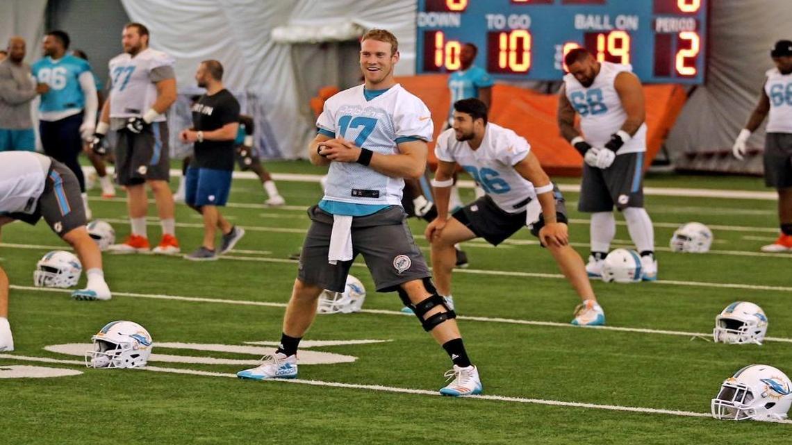 Miami Dolphins quarterback Ryan Tannehill smiles during OTAs practice at the Miami Dolphins training facility in Davie, Florida, May 25, 2017.