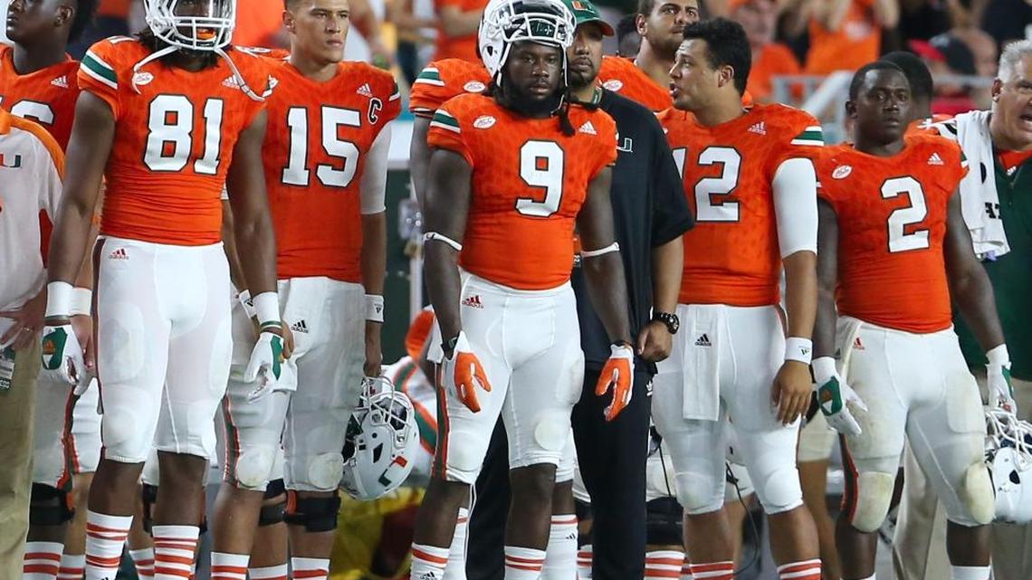 From left, Miami Hurricanes wide receiver Darrell Langham, quarterback Brad Kaaya, wide receiver Malcolm Lewis, quarterback Malik Rosier and running back Joseph Yearby look on from the sidelines in the fourth quarter of their game against Florida State at Hard Rock Stadium on Saturday.