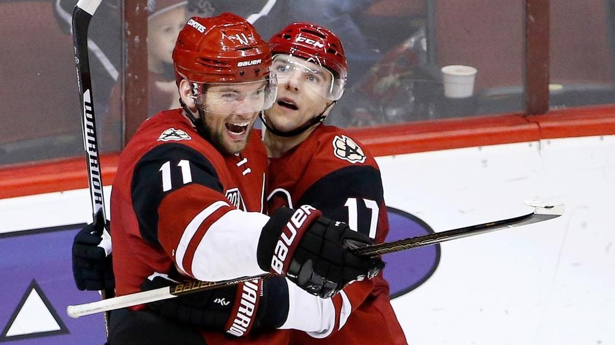 Arizona Coyotes center Martin Hanzal (11) smiles as he celebrates his game-winning goal against the San Jose Sharks with right wing Radim Vrbata (17) --- who signed with the Panthers this offseason --- during overtime of an NHL hockey game Saturday, Nov. 19, 2016, in Glendale, Ariz. The Coyotes defeated the Sharks 3-2. (AP Photo/Ross D. Franklin)