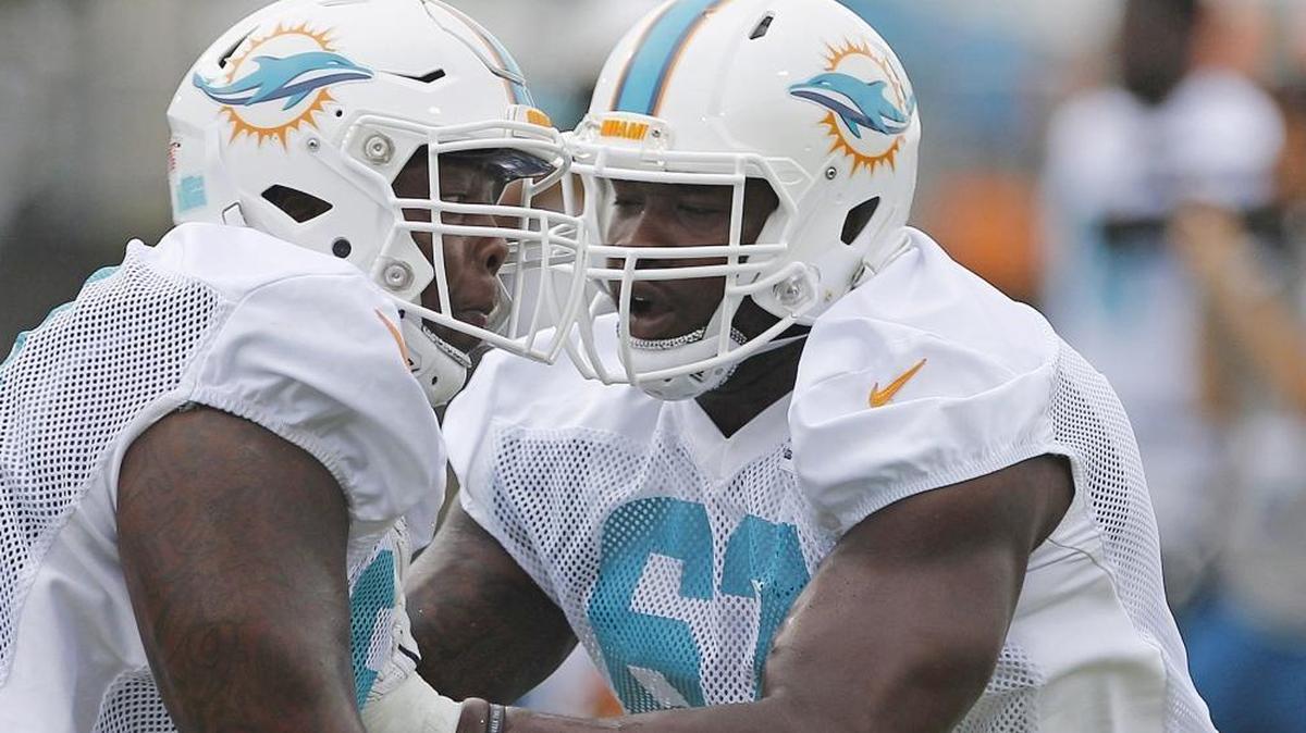 Ruben Carter, left, and Laremy Tunsil, participate in offensive line drills during practice. Miami Dolphins held early morning practice at their training facility in Davie, Florida on Sun., Aug. 14, 2016.