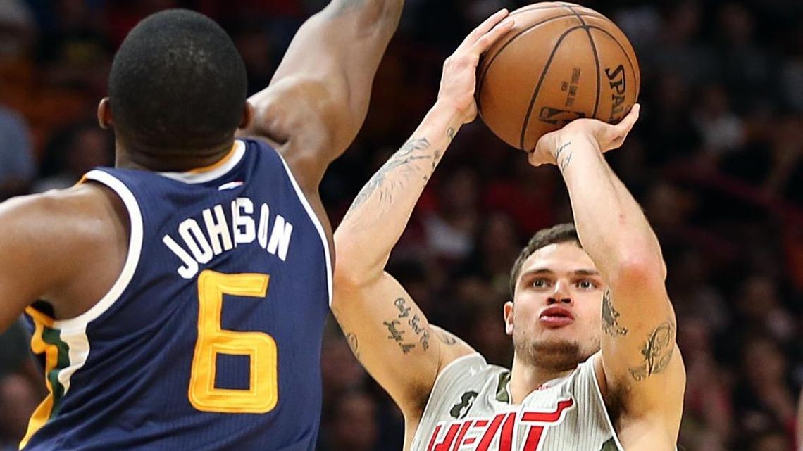 Miami Heat guard Tyler Johnson shoots against Utah's forward Joe Johnson in the first quarter of the Miami Heat and Utah Jazz game at AmericanAirlines Arena in Miami on Sat., Nov. 12, 2016.