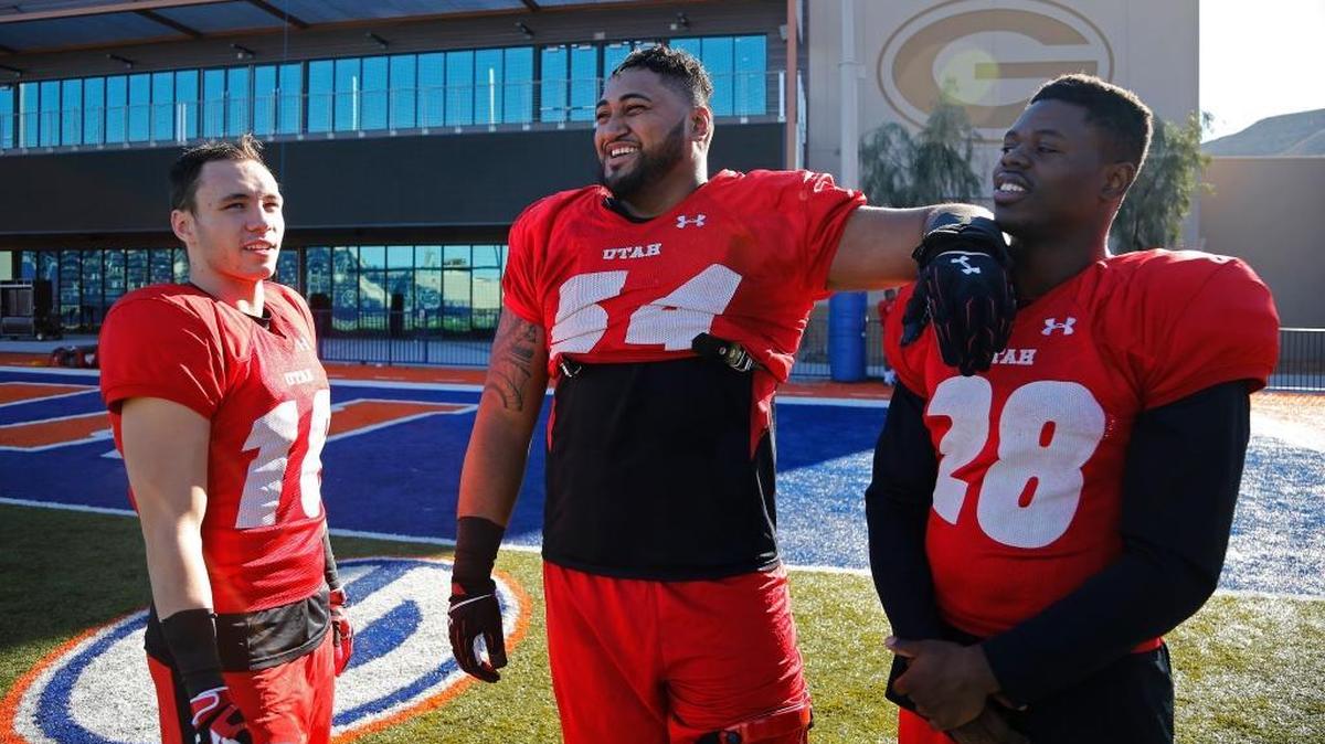 From left, Britain Covey, Isaac Asiata and Joe Williams of Utah talk after football practice Wednesday, Dec. 16, 2015, in Las Vegas. Utah is scheduled to play BYU Saturday in the Las Vegas Bowl.