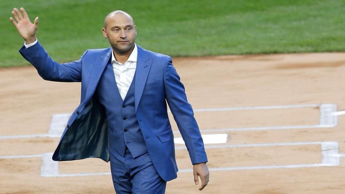 Former New York Yankee Derek Jeter waves to fans during a ceremony retiring his number at Yankee Stadium Sunday, May 14, 2017, in New York.