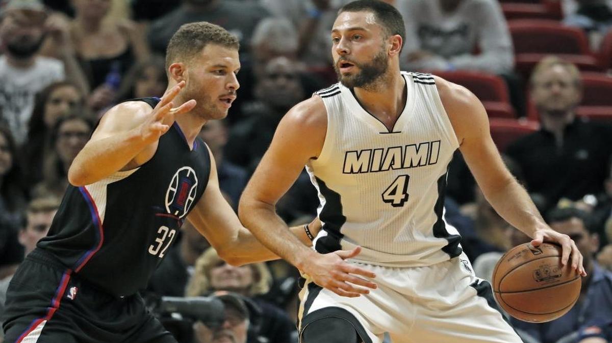 Miami Heat forward Josh McRoberts (4) goes up against LA Clippers forward Blake Griffin (32) in the third quarter as the Miami Heat host the Los Angeles Clippers at the AmericanAirlines Arena on Fri., Dec. 16, 2016.