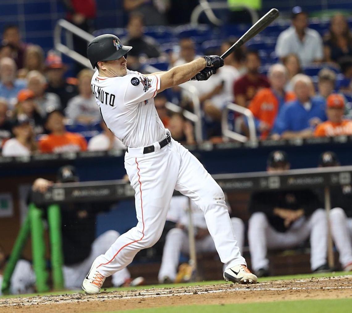 Marlins catcher J.T. Realmuto hits a double against the the Mets in a game in September.
