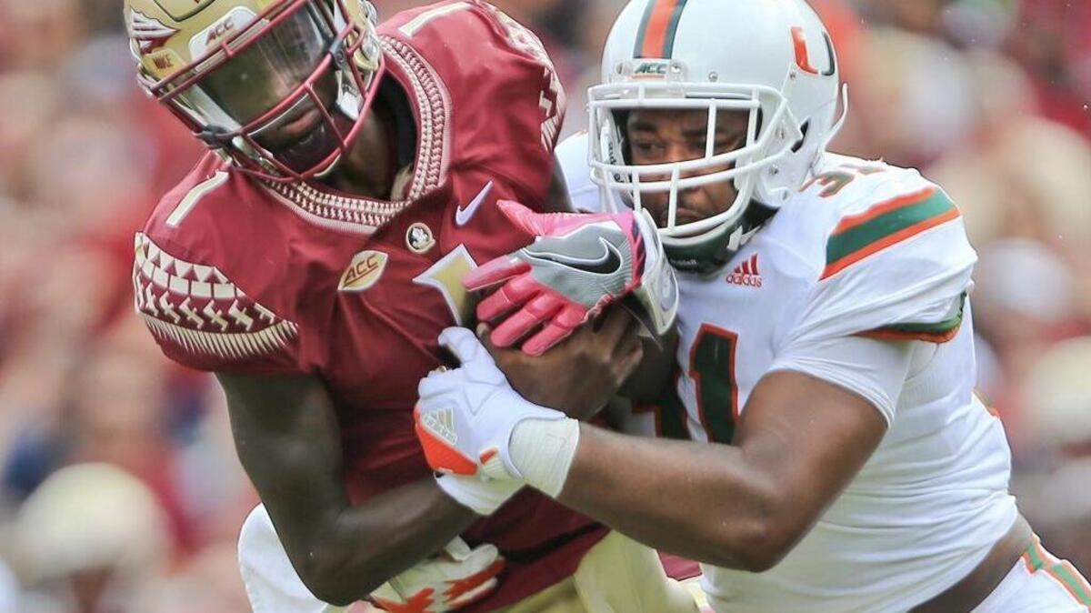 Florida State Seminoles quarterback James Blackman (1) is sacked by Miami Hurricanes defensive lineman Demetrius Jackson (31) in the second quarter as the Seminoles host the Miami Hurricanes at Doak Campbell Stadium in Tallahassee on Saturday, October 7, 2017.