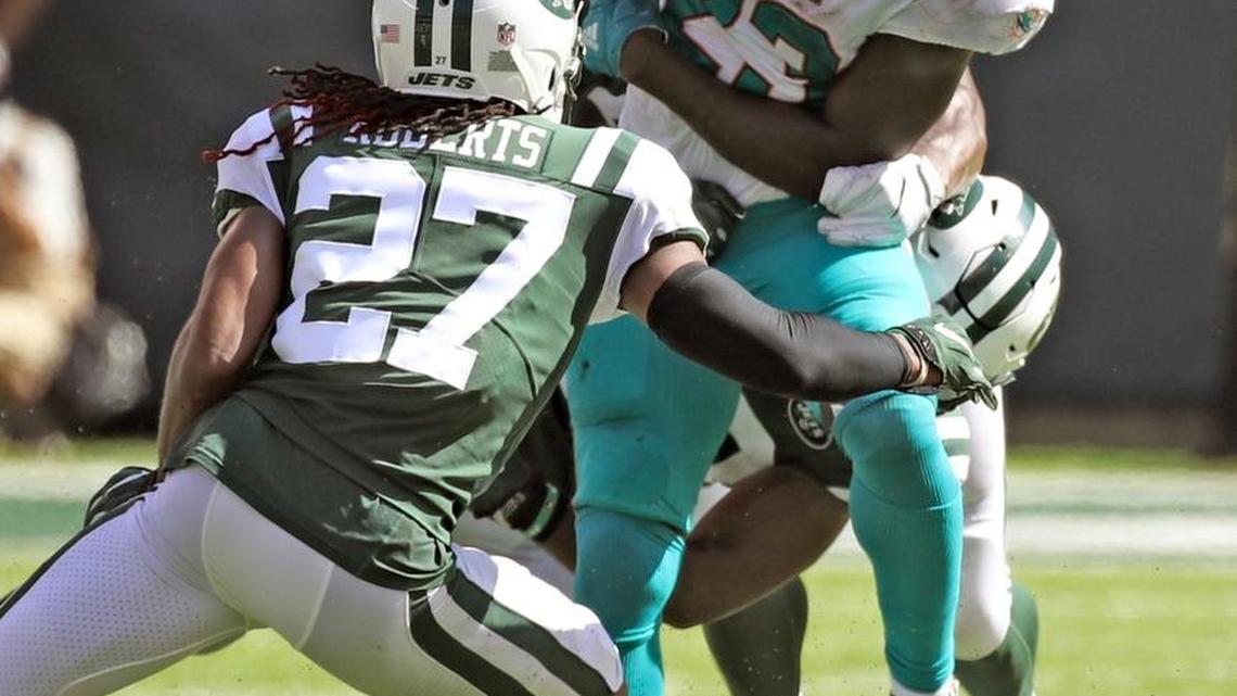 Miami Dolphins running back Jay Ajayi (23) is stoped by the Jets in the second quarter as the New York Jets host the Miami Dolphins at Met Life Stadium on Sunday, September 24, 2017.