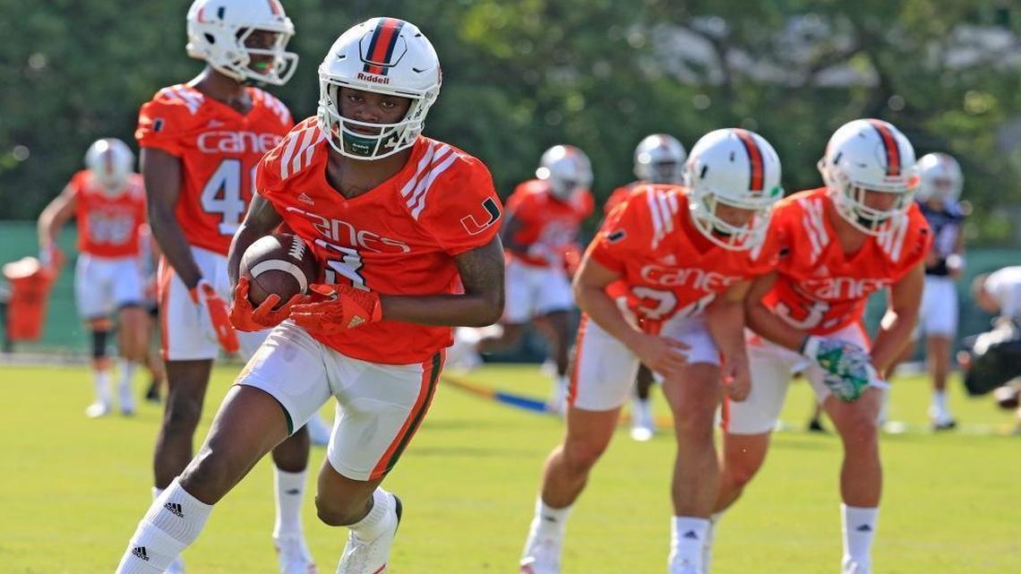 Wide receiver Mike Harley (3) runs drills as the University of Miami opens fall football camp at Greentree Field on Tuesday, August 1, 2017.