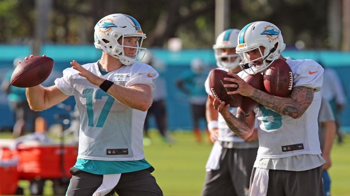 Miami Dolphins QB Matt Moore holds ball for Ryan Tannehill during training camp at the Miami Dolphins training facility in Davie, Fl, July 28, 2017.