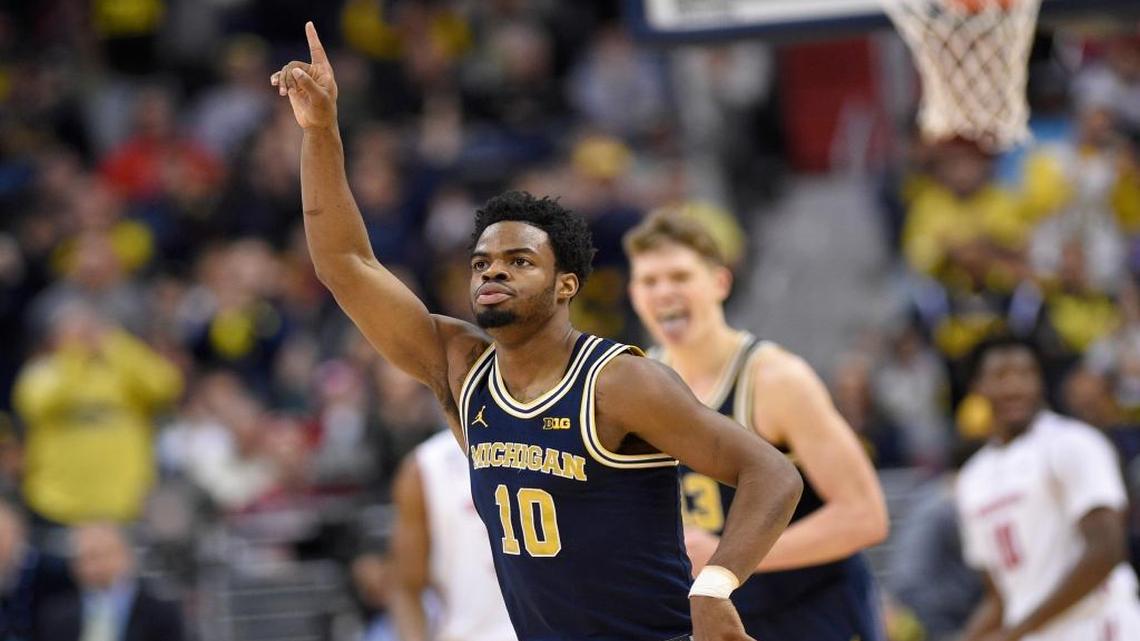 Michigan guard Derrick Walton Jr. (10) reacts after he hit a 3-pointer during the first half of the Big Ten NCAA college basketball championship game against Wisconsin, Sunday, March 12, 2017, in Washington.