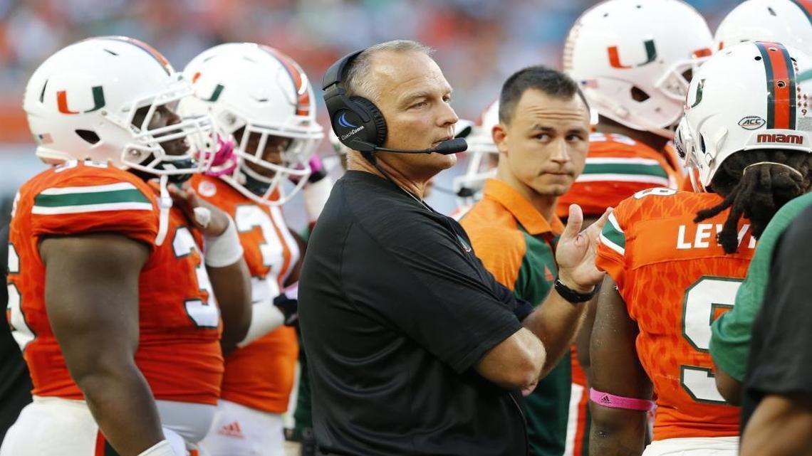 Miami Hurricanes head coach Mark Richt with players on the field as the University of Miami Hurricanes host the University of North Carolina Tar Heels at Hard Rock Stadium on Sat., Oct. 15, 2016.
