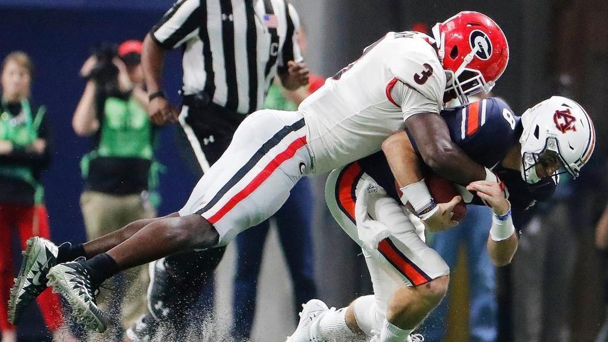 Georgia linebacker Roquan Smith (3) tackles Auburn quarterback Jarrett Stidham (8) during the first half of the Southeastern Conference championship earlier this month. Smith, a projected top 15 NFL draft pick, was selected to the AP All-America team.