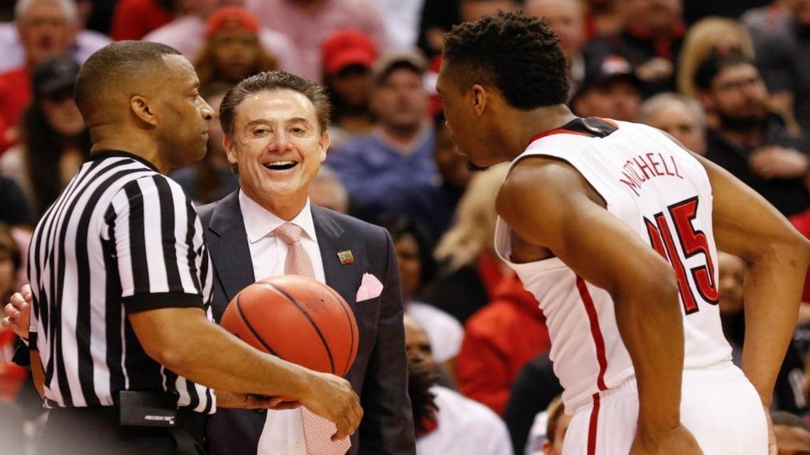 Louisville Cardinals head coach Rick Pitino and Louisville Cardinals guard Donovan Mitchell (45) joke with the official on a play in the second half Fri., March 17, 2017, at Bankers Life Fieldhouse in Indianapolis, Ind. Louisville beat Jacksonville State 78-63.