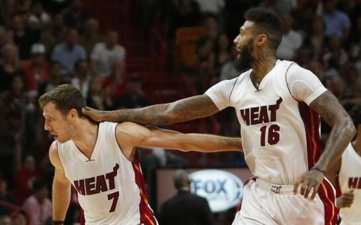 Miami Heat guard Goran Dragic (7) is congratulated by James Johnson (16) after a play during the fourth quarter of an NBA basketball game against the Washington Wizards at AmericanAirlines Arena in Miami on Wednesday, March 12, 2017.