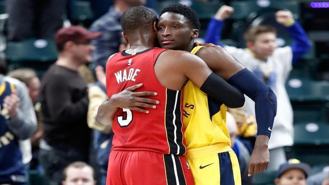 The Pacers’ Victor Oladipo and the Heat’s Dwyane Wade embrace after Indiana’s overtime win Sunday at BankersLife Fieldhouse. (Photo by Andy Lyons/Getty Images)