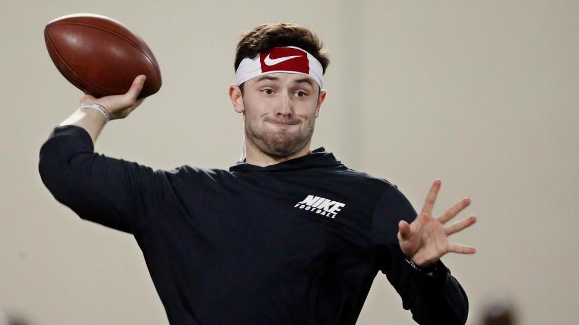 Oklahoma quarterback Baker Mayfield - seen here thowing passes during a drill at Oklahoma’s Pro Day last week - worked out privately for the Dolphins on Wednesday. (AP Photo/Sue Ogrocki)