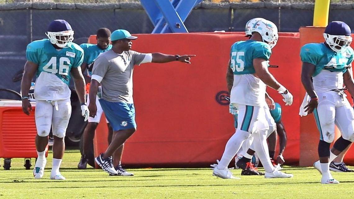 Defensive coordinator Vance Joseph works with the defense at the Miami Dolphins training facility in Davie, Florida, Aug. 5, 2016.
