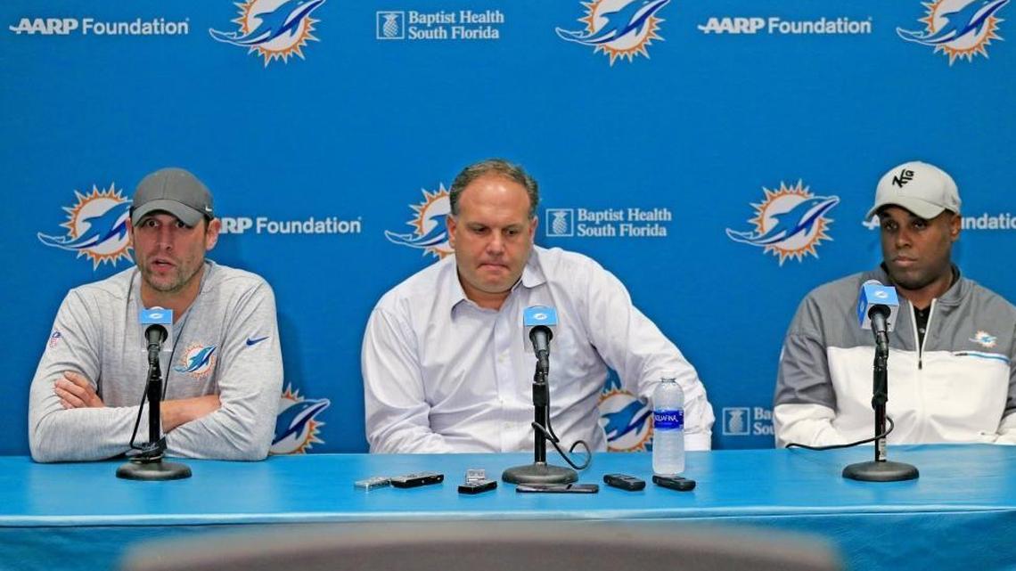 Dolphins coach Adam Gase, Executive Vice President of Football Operations Mike Tannenbaum and General Manager Chris Grier, left to right, will have difficult decisions in addressing several personnel needs.