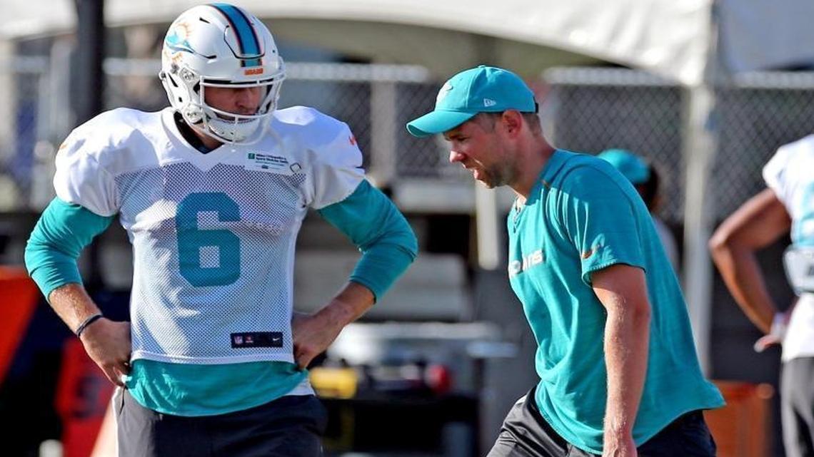 Miami Dolphins quarterback Jay Cutler (6) with quarterback coach Bo Hardegree at Miami Dolphins training camp in Davie, Fl, Aug. 8, 2017.