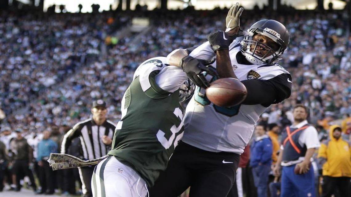New York Jets strong safety Dion Bailey (34) breaks up a pass in the end zone intended for Jacksonville Jaguars tight end Julius Thomas (80) during the fourth quarter of an NFL football game, Sun., Nov. 8, 2015, in East Rutherford, N.J.