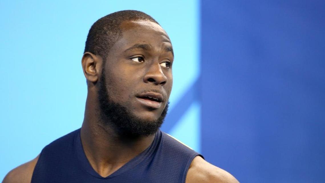 Illinois defensive end Carroll Phillips is seen before a drill at the 2017 NFL football scouting combine Sun., March 5, 2017, in Indianapolis.