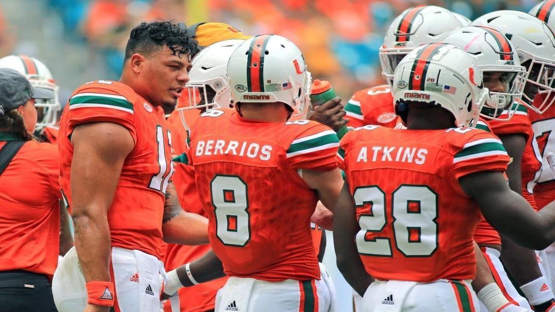 Miami Hurricanes quarterback Malik Rosier (12) with teammates as the University of Miami hosts Bethune-Cookman at Hard Rock Stadium on Saturday, Sept. 2, 2017.
