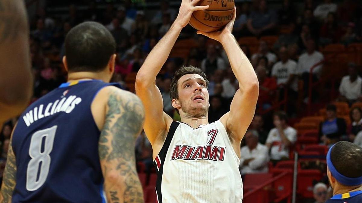 Miami Heat guard Goran Dragic, shoots to the basket against Mavericks' guard Deron Williams, in the first quarter of the Miami Heat vs Dallas Mavericks, NBA game at AmericanAirlines Arena in Miami on Thursday, January 19, 2017.
