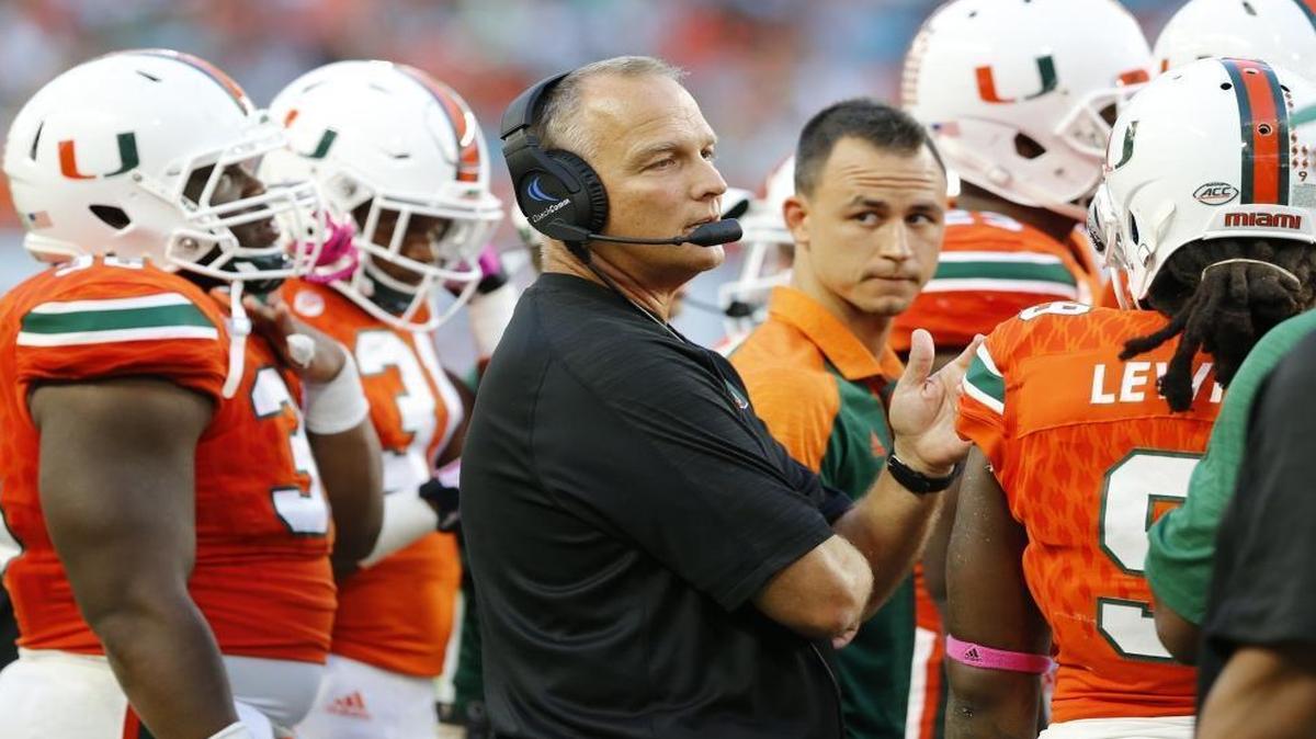 Miami Hurricanes head coach Mark Richt with players on the field as the University of Miami Hurricanes host the University of North Carolina Tar Heels at Hard Rock Stadium on Sat., Oct. 15, 2016.