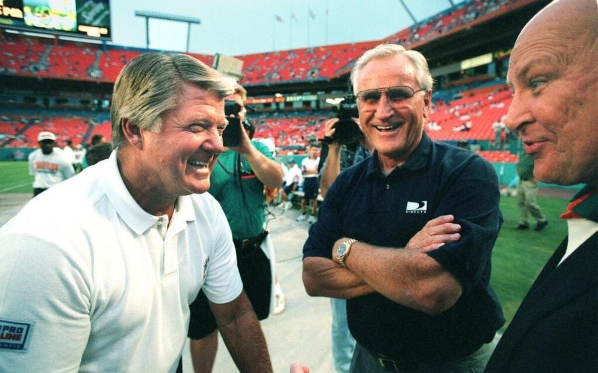 From left: Jimmy Johnson; Don Shula; and Wayne Huizenga share a laugh moments before the game in this Aug. 19, 1996, file photo.