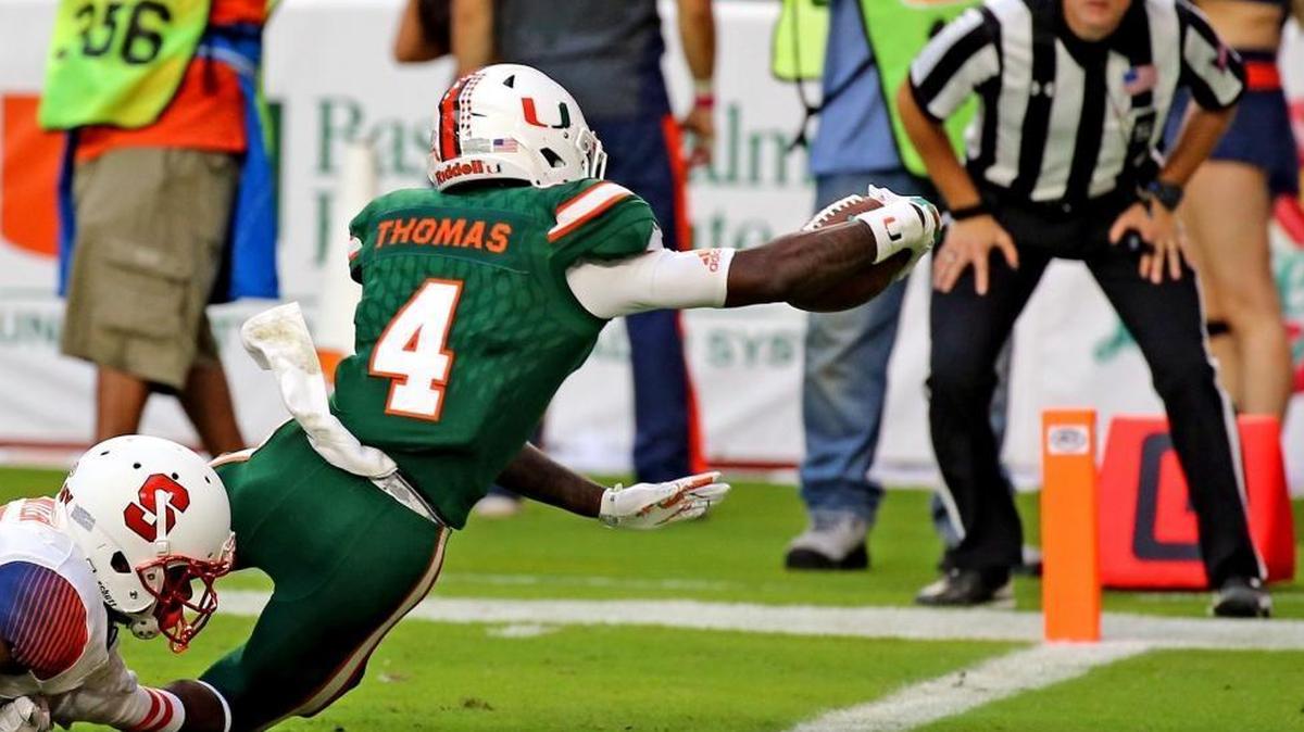 Miami Hurricanes freshman receiver Jeff Thomas (4) reaches for a third quarter touchdown against Syracuse. Thomas’ speed at receiver has been an asset for UM.