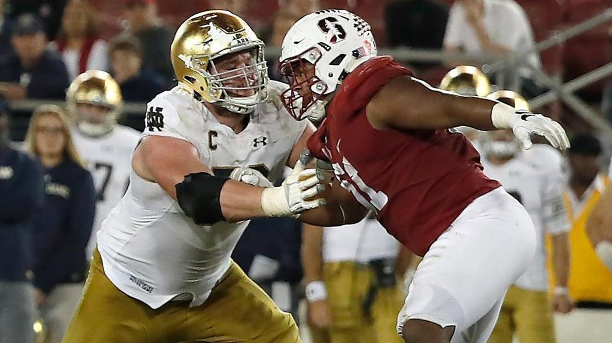 Notre Dame offensive lineman Quenton Nelson (56) blocks against Stanford defensive end Jovan Swann (51) during their Nov. 25 game. ESPN’s Todd McShay projects the Dolphins to pick Nelson in his first mock draft.