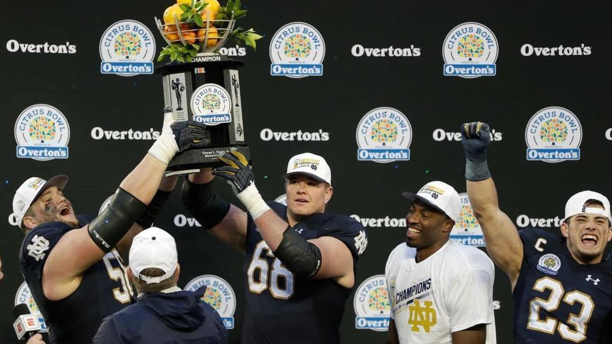 The two Notre Dame players on the left in this photo, guard Quenton Nelson (left) and tackle Mike McGlinchey (one over from left), are possibilities for the Dolphins’ draft pick at No. 11 in the first round. Here, they celebrate with teammates after the Jan. 1 Citrus Bowl win against LSU. (AP Photo/John Raoux)