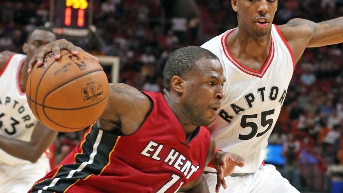 Miami Heat Dion Waiters drives the ball past Toronto Raptors Delon Wright at the AmericanAirlines Arena in Miami, Florida, March 11, 2017.