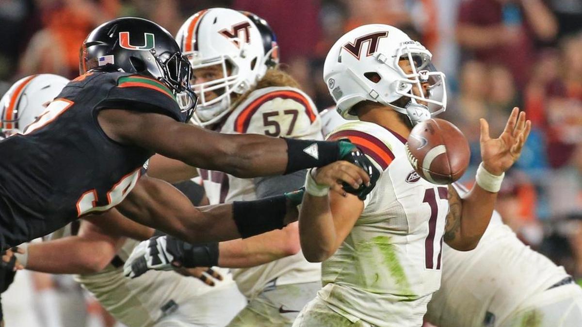 Miami Hurricanes defensive lineman Jonathan Garvin (97) knocks the ball loose from Virginia Tech Hokies quarterback Josh Jackson (17) in the fourth quarter of UM’s win on Nov. 4. Garvin will be a key component of the Hurricanes’ defensive line.