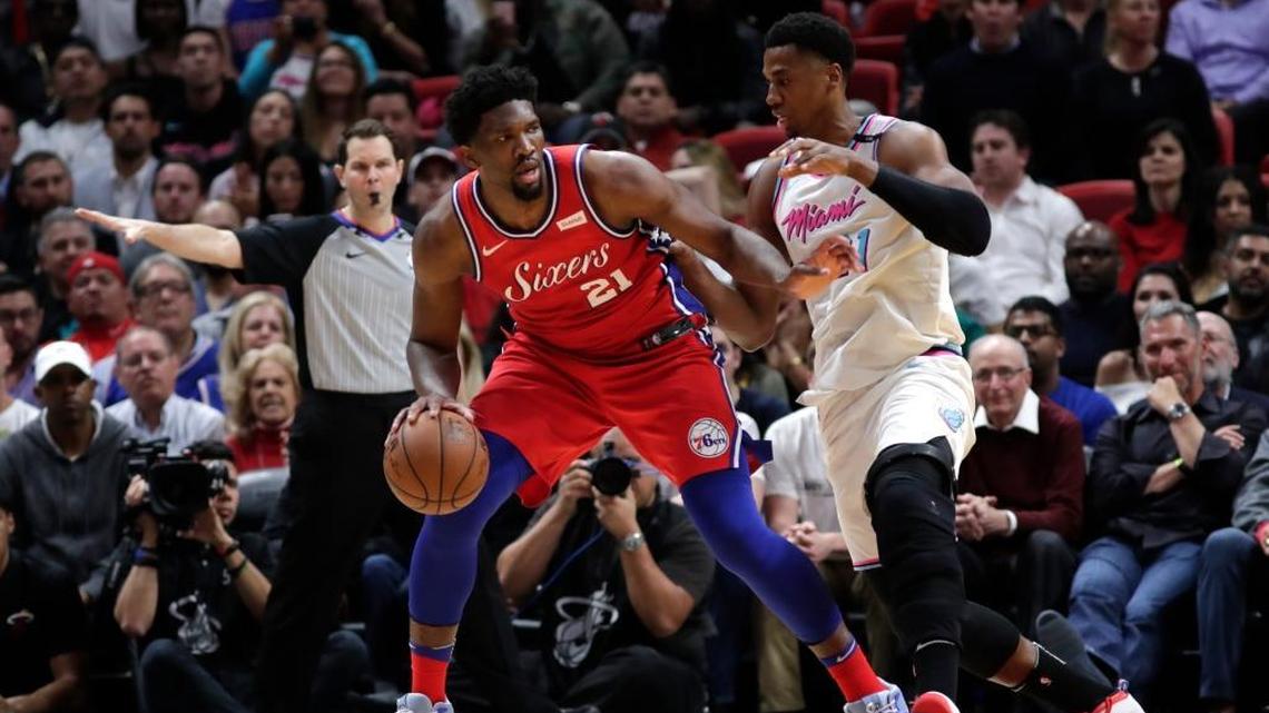 Philadelphia 76ers center Joel Embiid tries to drive against Miami Heat center Hassan Whiteside.