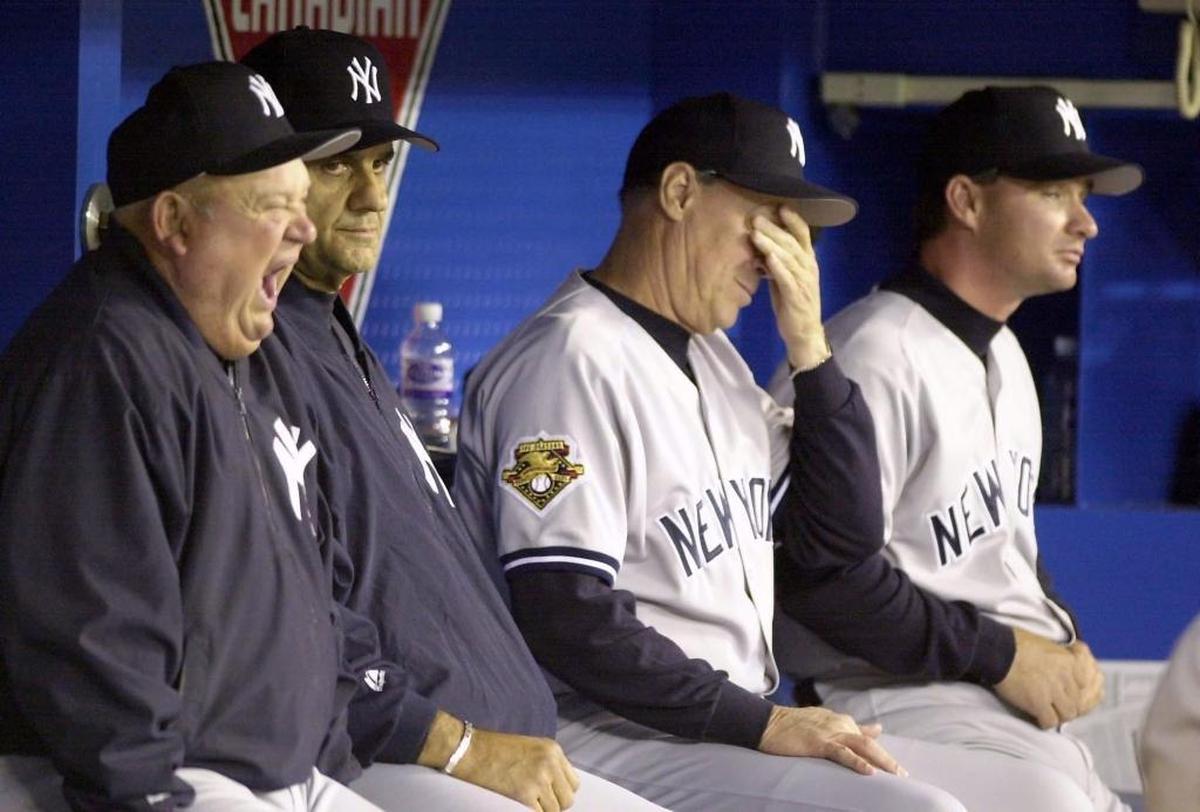 In this April 19, 2001 photo, New York Yankees, from left, bench coach Don Zimmer, manager Joe Torre, pitching coach Mel Stottlemyre and bench coach Gary Denbo show signs of fatigue during the 16th inning of play against the Toronto Blue Jays in Toronto. Denbo is the Miami Marlins’ new vice president of player development.