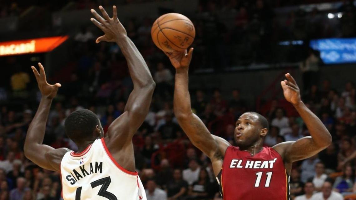 Miami Heat Dion Waiters shoots over Toronto Raptors Pascal Siakam at the AmericanAirlines Arena in Miami, Florida, March 11, 2017.
