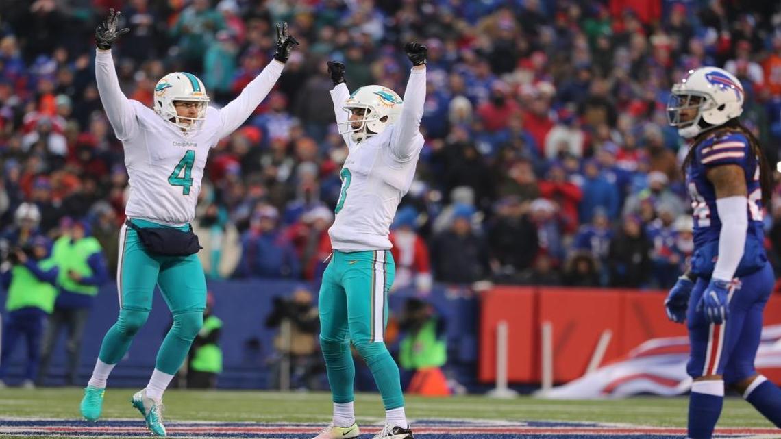 Miami Dolphins punter Matt Darr (4) and Miami Dolphins kicker Andrew Franks (3) celebrate after kicking a field goal to tie the game and pushing it into overtime as the Buffalo Bills host the Miami Dolphins at New Era Field in Orchard Park, NY on Sat., Dec. 24, 2016.