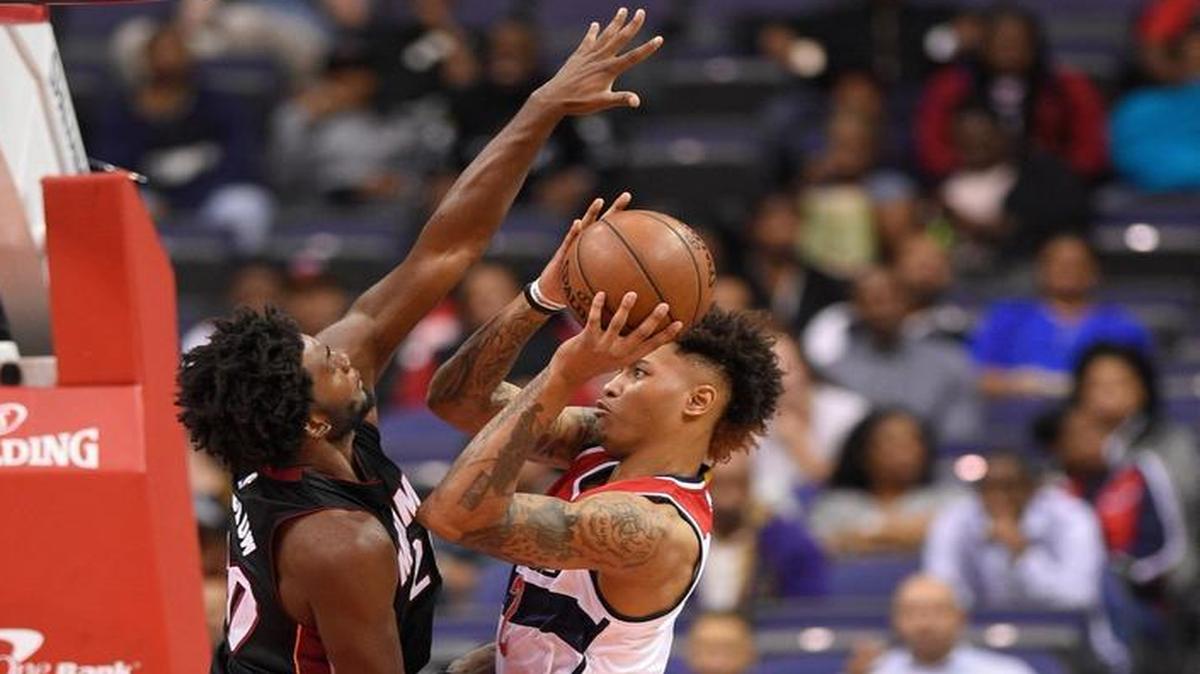 Washington Wizards forward Kelly Oubre Jr., right, goes to the basket against Miami Heat forward Justise Winslow, left, during the first half of an NBA preseason basketball game, Tues., Oct. 4, 2016, in Washington.