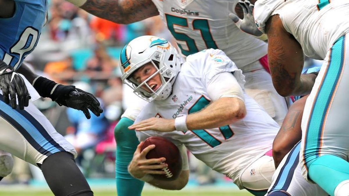 Miami Dolphins Ryan Tannehill is sacked in the fourth quarter as the Dolphins play the Tennessee Titians at Hard Rock Stadium on Sunday, Oct. 9, 2016.