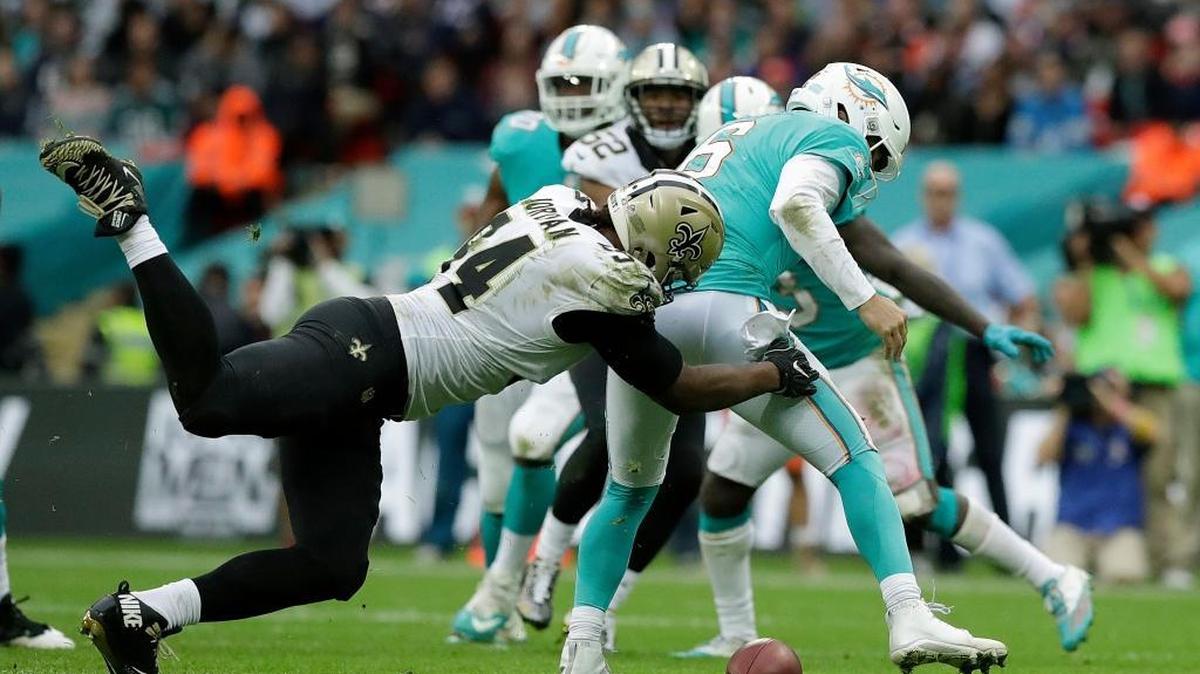 Miami Dolphins quarterback Jay Cutler (6) is sacked by New Orleans Saints defensive end Cameron Jordan (94) during the second half of an NFL football game at Wembley Stadium in London, Sunday Oct. 1, 2017. (AP Photo/Matt Dunham)