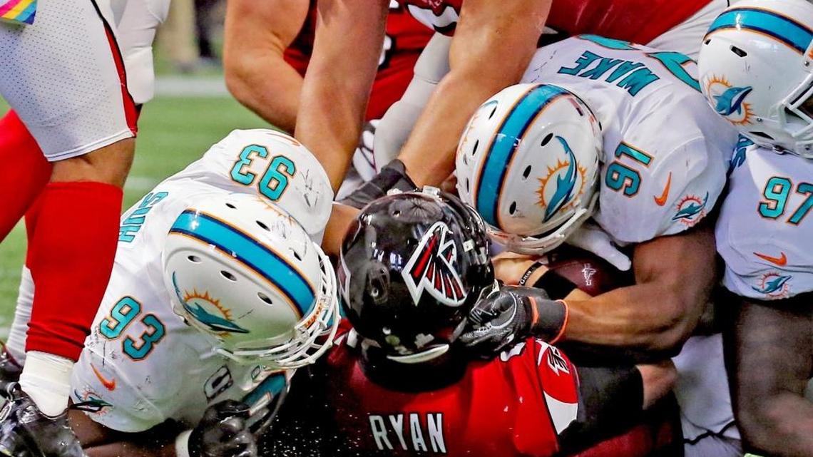 Miami Dolphins Ndamukong Suh (93) and Cameron Wake (91) sack Atlanta Falcons quarterback Matt Ryan (2) in the second quarter of the Oct. 15 game at Atlanta.
