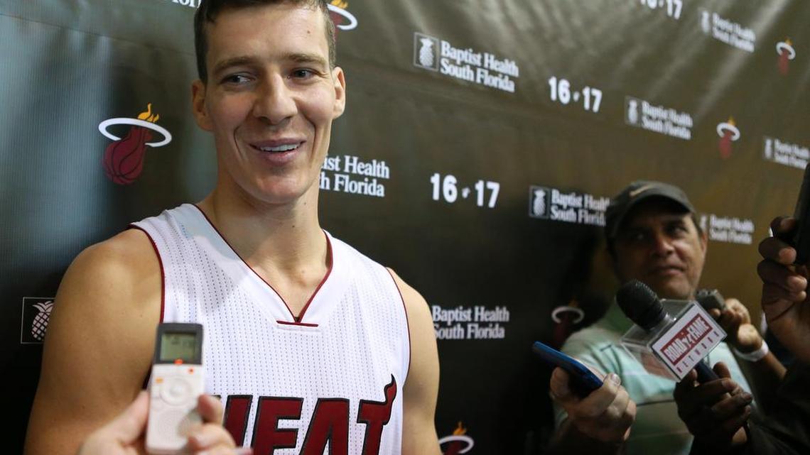 Miami Heat guard Goran Dragic peaks to the media during the Media Day for the 2016-17 NBA season at AmericanAirlines Arena in Miami on Mon., Sept. 26, 2016.
