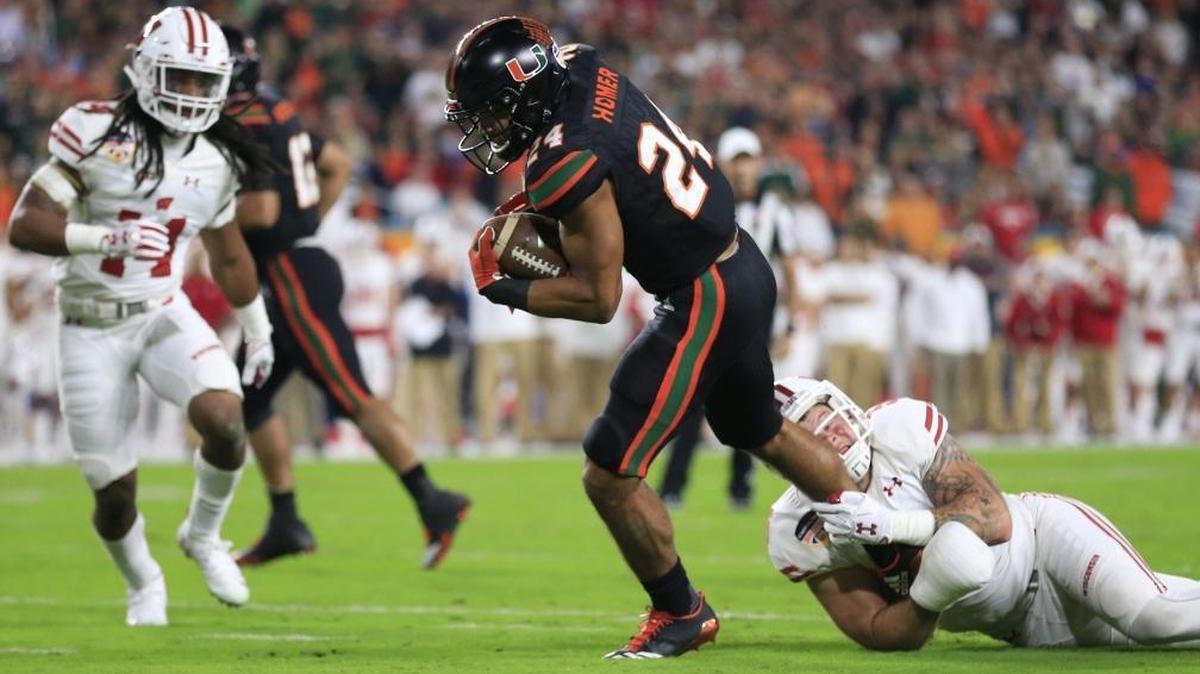 Miami Hurricanes running back Travis Homer (24) scores a touchdown against Wisconsin in the Orange Bowl. Homer is among key returning UM players.