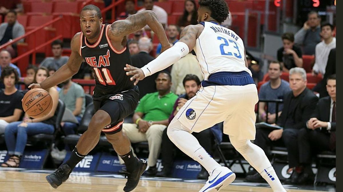 Heat guard Dion Waiters drives to the basket against Mavericks guard Wesley Matthews on Dec. 22. Waiters remains sidelined with a sprained left ankle.