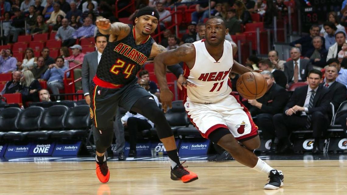 Miami Heat guard Dion Waiters drives against Atlanta Hawks forward Kent Bazemore during the third quarter of an NBA basketball game at AmericanAirlines Arena in Miami on Wed., Feb. 1, 2017.